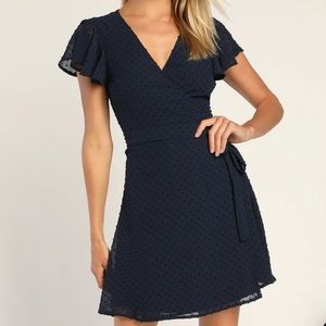 Much to Celebrate Navy Swiss Dot Flutter Sleeve Wrap Mini Dress